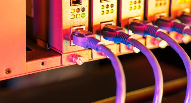 network cable connecting on network core switch close up