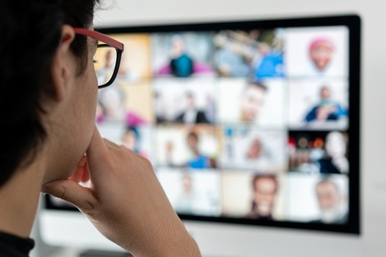man staring at large screen