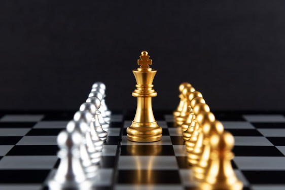 Golden Chess King and Pawn with Silver Colored Pawns on the sides