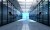 Empty data center with person walking away at the far end.