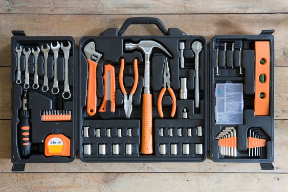a photo of an open toolbox that contains an assortment of hardware