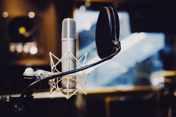 Podcasting studio setup with recording equipment and microphone
