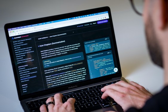 Assembly AI CEO uses a laptop showing the company's code.