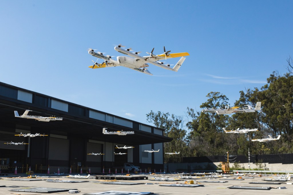 Multiple drones hovering over courtyard