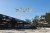 Multiple drones hovering over courtyard