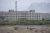 This photo taken on June 2, 2019 shows a facility believed to be a re-education camp where mostly Muslim ethnic minorities are detained, in Artux, north of Kashgar in China's western Xinjiang region. - While Muslims around the world celebrated the end of Ramadan with early morning prayers and festivities this week, the recent destruction of dozens of mosques in Xinjiang highlights the increasing pressure Uighurs and other ethnic minorities face in the heavily-policed region. (Photo by GREG BAKER / AFP) / To go with AFP story China-politics-rights-religion-Xinjiang, FOCUS by Eva Xiao and Pak Yiu (Photo credit should read GREG BAKER/AFP via Getty Images)