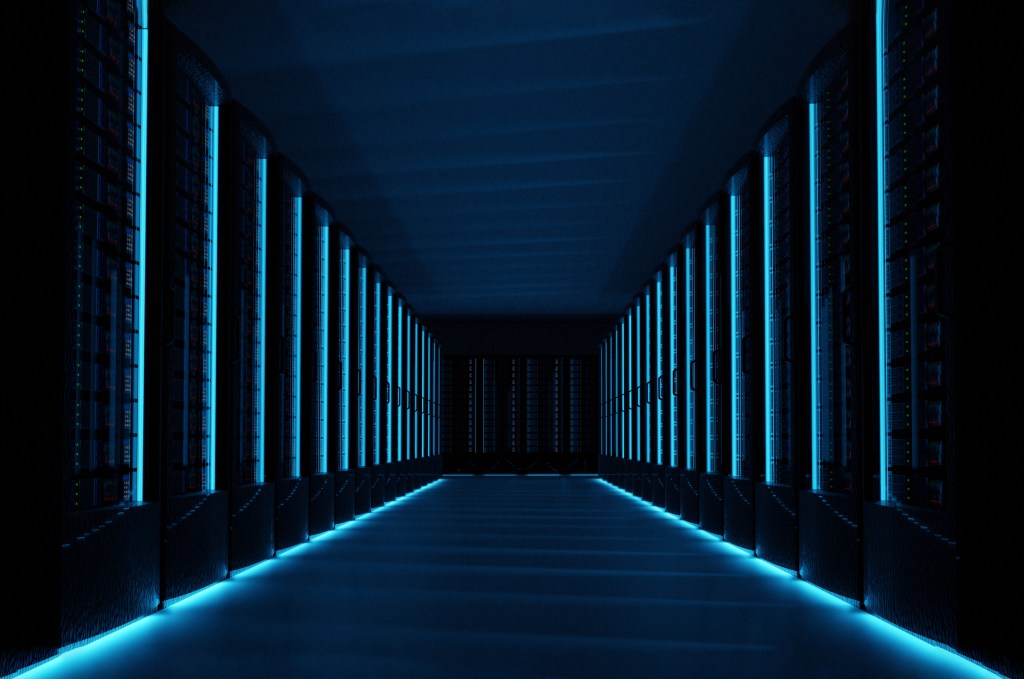 Servers in dark data center room with computers and storage systems