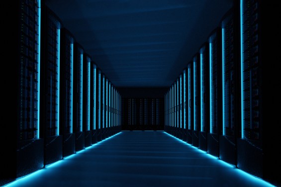 Servers in dark data center room with computers and storage systems