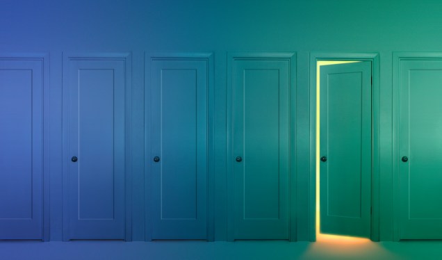 Image of closed doors with one cracked open.