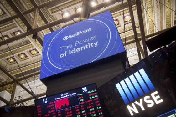 A monitor displays Sailpoint Technologies Holdings Inc. signage during the company's initial public offering (IPO) on the floor of the New York Stock Exchange (NYSE) in New York, U.S., on Friday, Nov. 17, 2017. U.S. stocks edged lower after the best rally in two months, while Treasuries advanced as investors assessed the prospects for corporate tax cuts. Photographer: Michael Nagle/Bloomberg via Getty Images