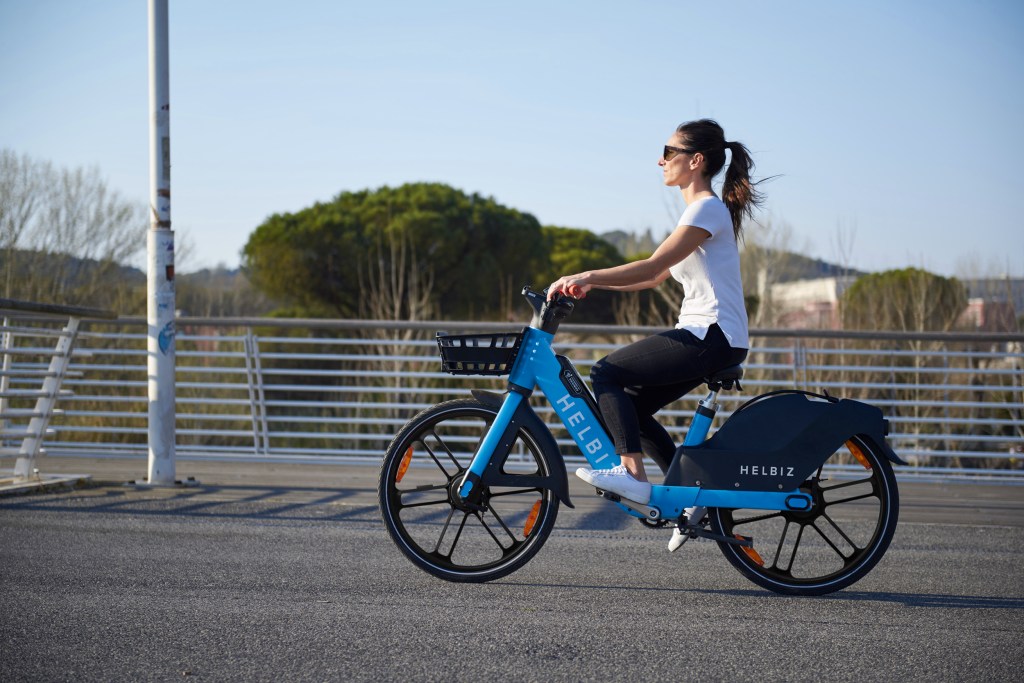 woman riding helbiz bike