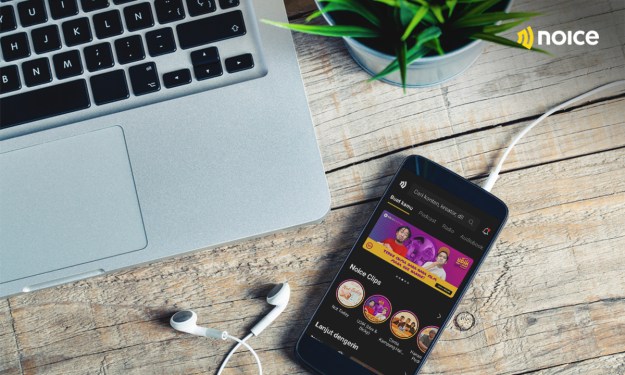Photo of a smartphone displaying Indonesian audio content NOICE's app