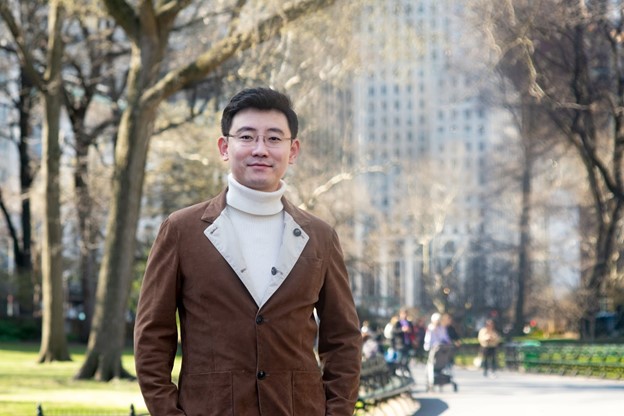 A picture of Ronghui Gu, founder and CEO of CertiK in front of trees