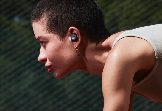 Runner with earbuds