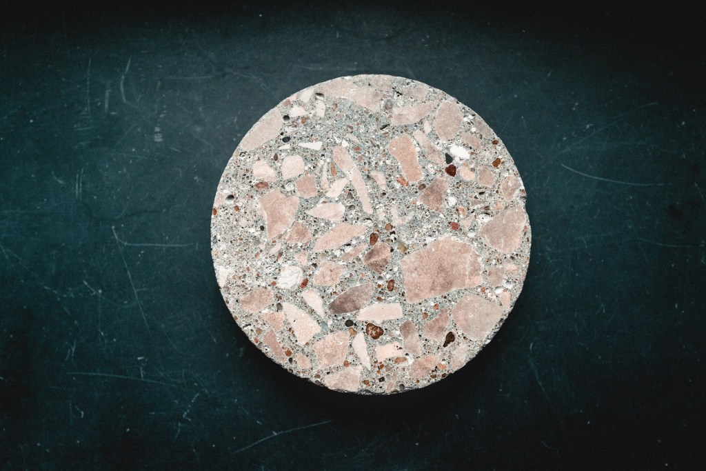 A puck of concrete created through an AI derived formula.