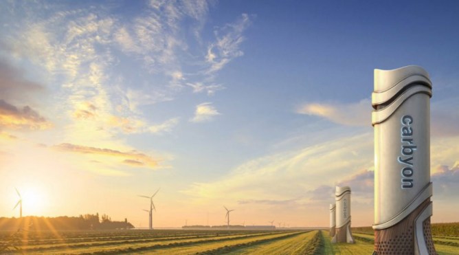 Artists impression of a carbon removal tower in a sunny field.
