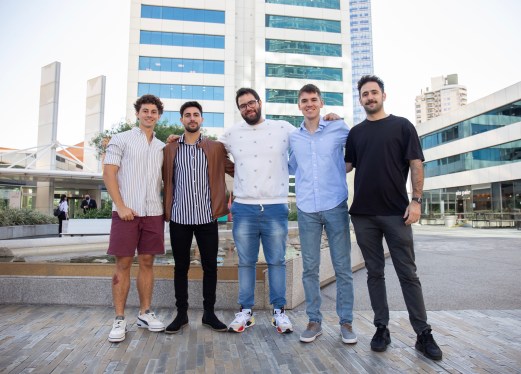 A photo of five Strike Security employees.