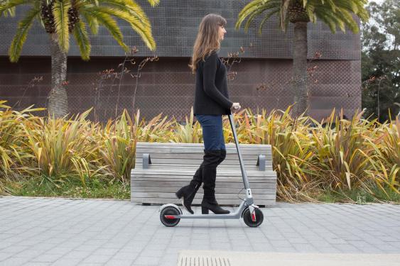 woman riding unagi escooter