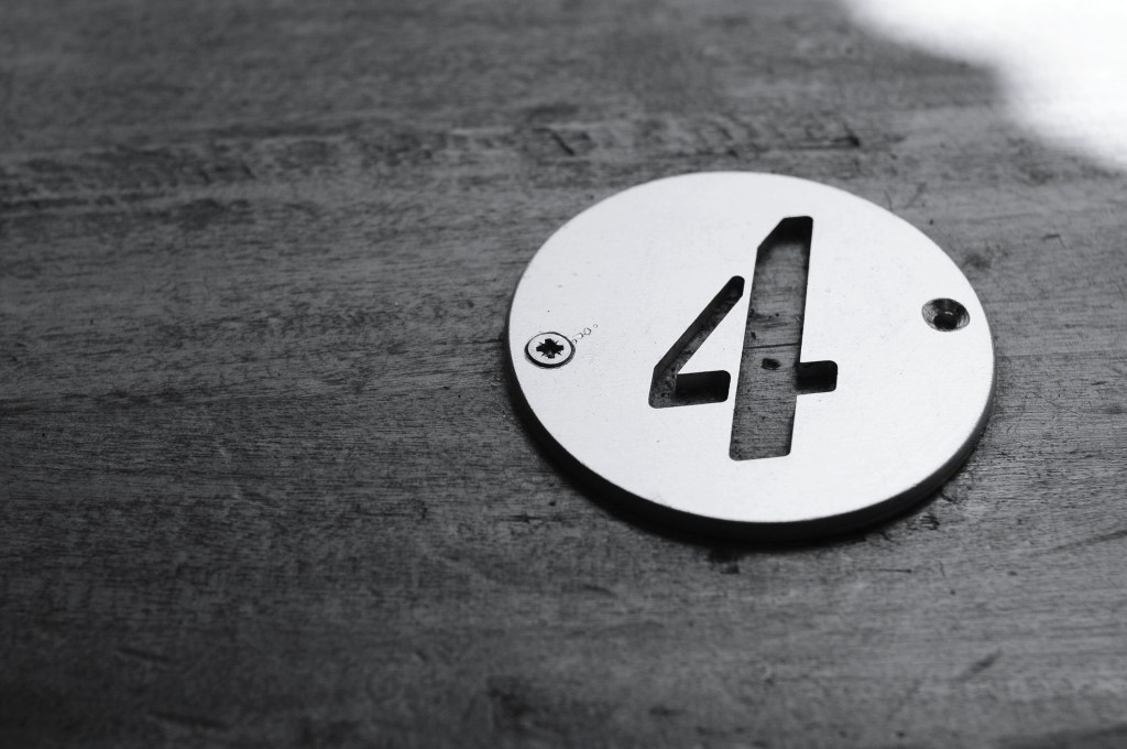 Close-Up Of Number 4 On Table. 4 questions to ask when building a deep learning model