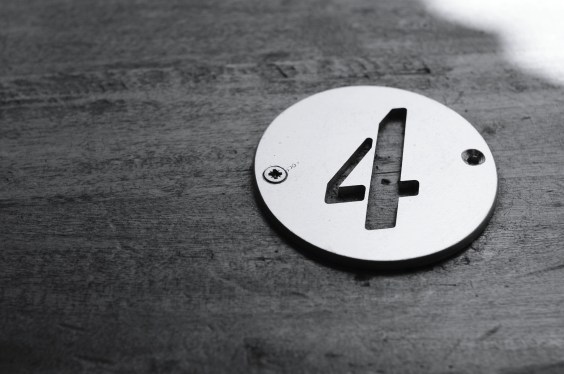 Close-Up Of Number 4 On Table. 4 questions to ask when building a deep learning model