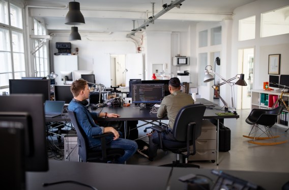 Computer programmers working on a new project