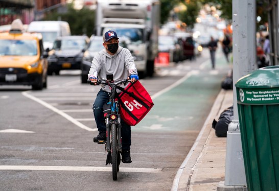 Grubhub Delivery Man in Black Mask Rides South on Second Avenue on the Upper East Side