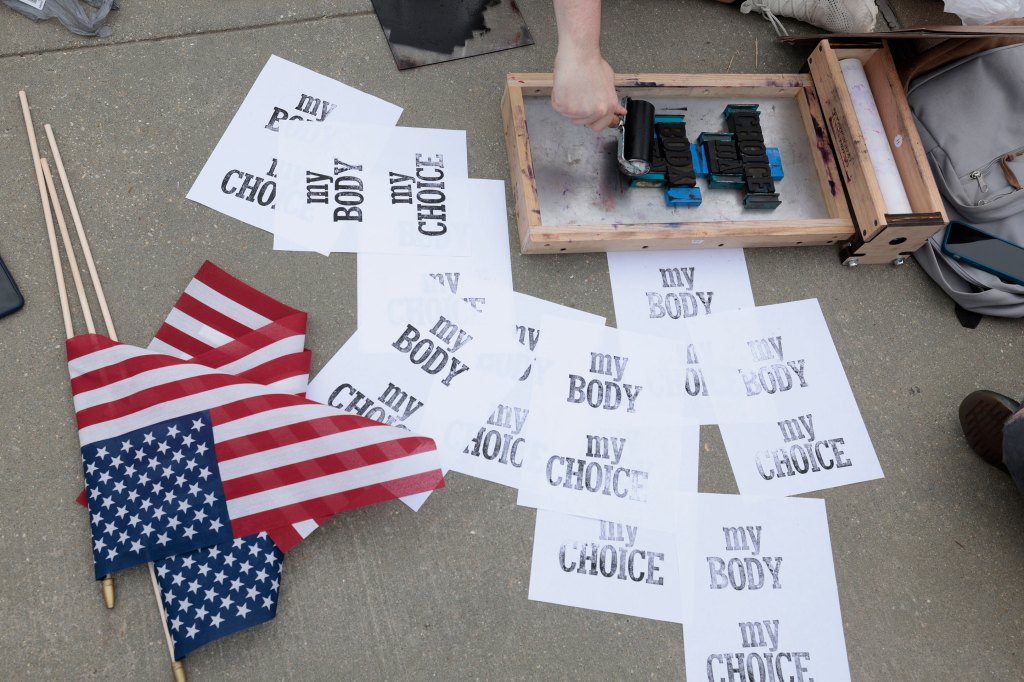 Pro-choice demonstrators print signs in front of the U.S. Supreme Court Building on May 03, 2022 in Washington, DC.
