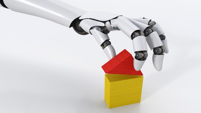 Robot hand building house with building blocks