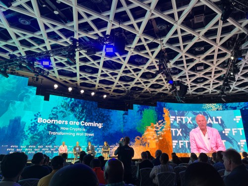 A panel titled "Boomers are coming" at Crypto Bahamas in April 2022.