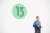 man standing in front of no. 13