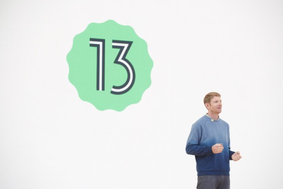 man standing in front of no. 13