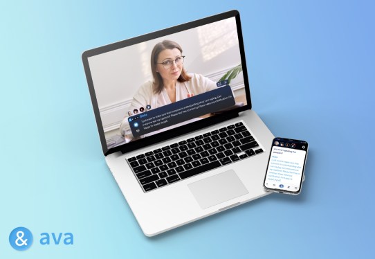 Image of Ava captioning on a laptop and phone.