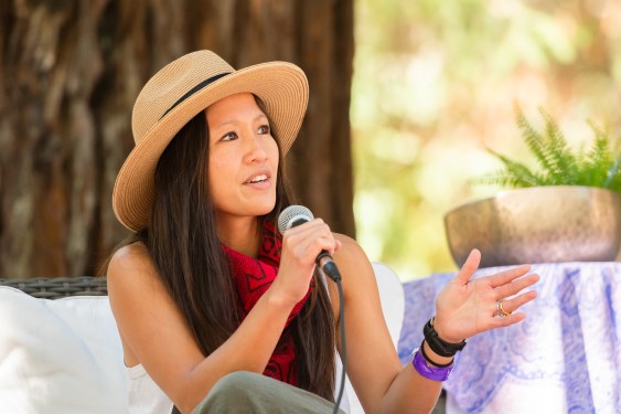 seated woman with mic