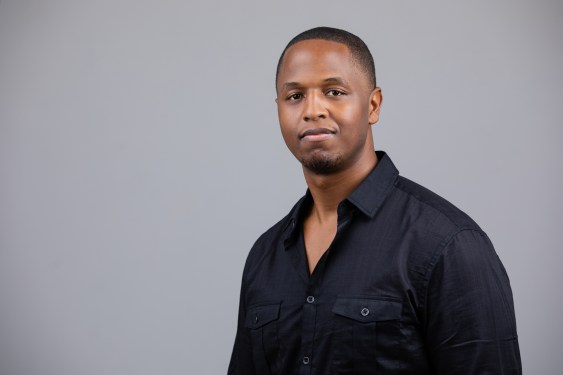 Benjamin Harvey looks at the camera wearing a black shirt