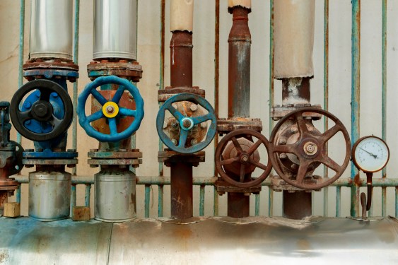old water steam leak valve in old industry factory