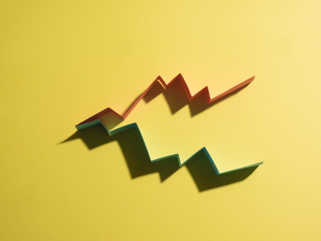 Colorful graphs on yellow background that imitate a business results chart.