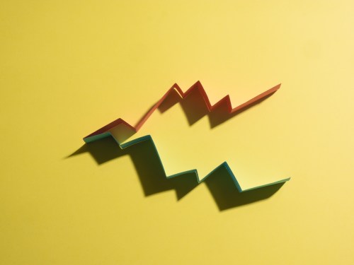 Colorful graphs on yellow background that imitate a business results chart.