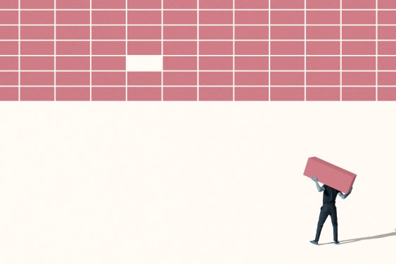 Rear view of young man carrying pink block while standing on white background; building software company