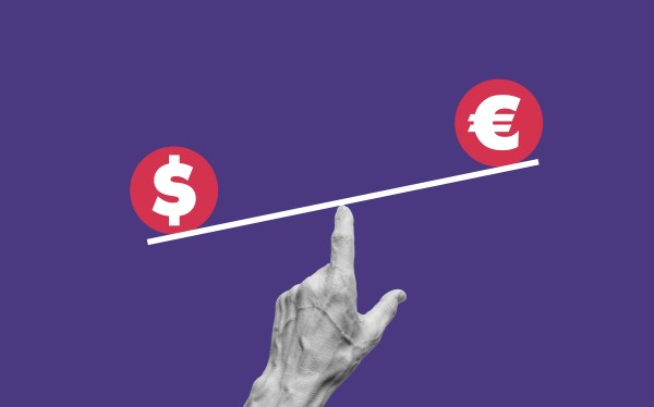 Image of a seesaw on a finger with a dollar and euro symbol on each side.