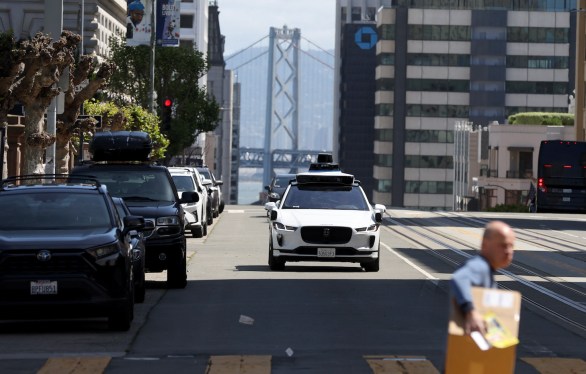 SAN FRANCISCO, CALIFORNIA - APRIL 11: A Waymo autonomous vehicle drives along California Street on April 11, 2022 in San Francisco, California. San Francisco is serving as testing grounds for autonomous vehicles with Waymo, a Google subsidiary and Cruise, a subsidiary of General Motors, logging millions of test miles throughout San Francisco in 2021. (Photo by Justin Sullivan/Getty Images)