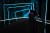 Image of a man using virtual reality glasses amid lights.