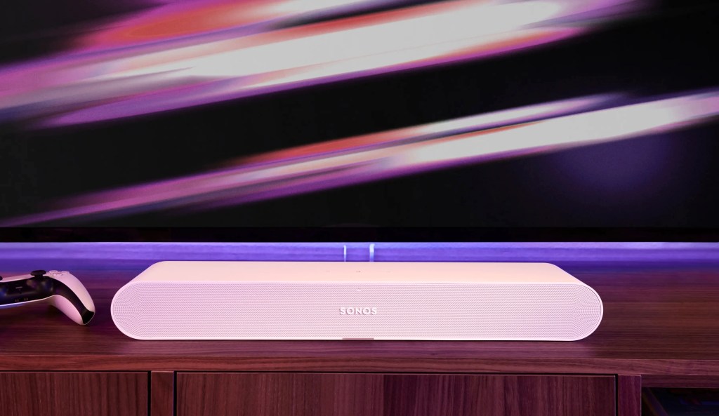 A Sonos Ray soundbar underneath a TV.