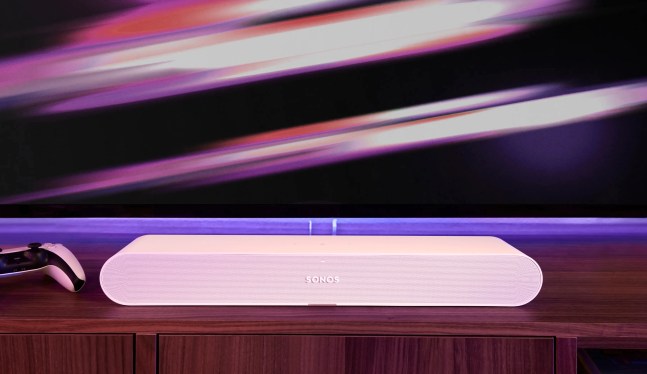 A Sonos Ray soundbar underneath a TV.