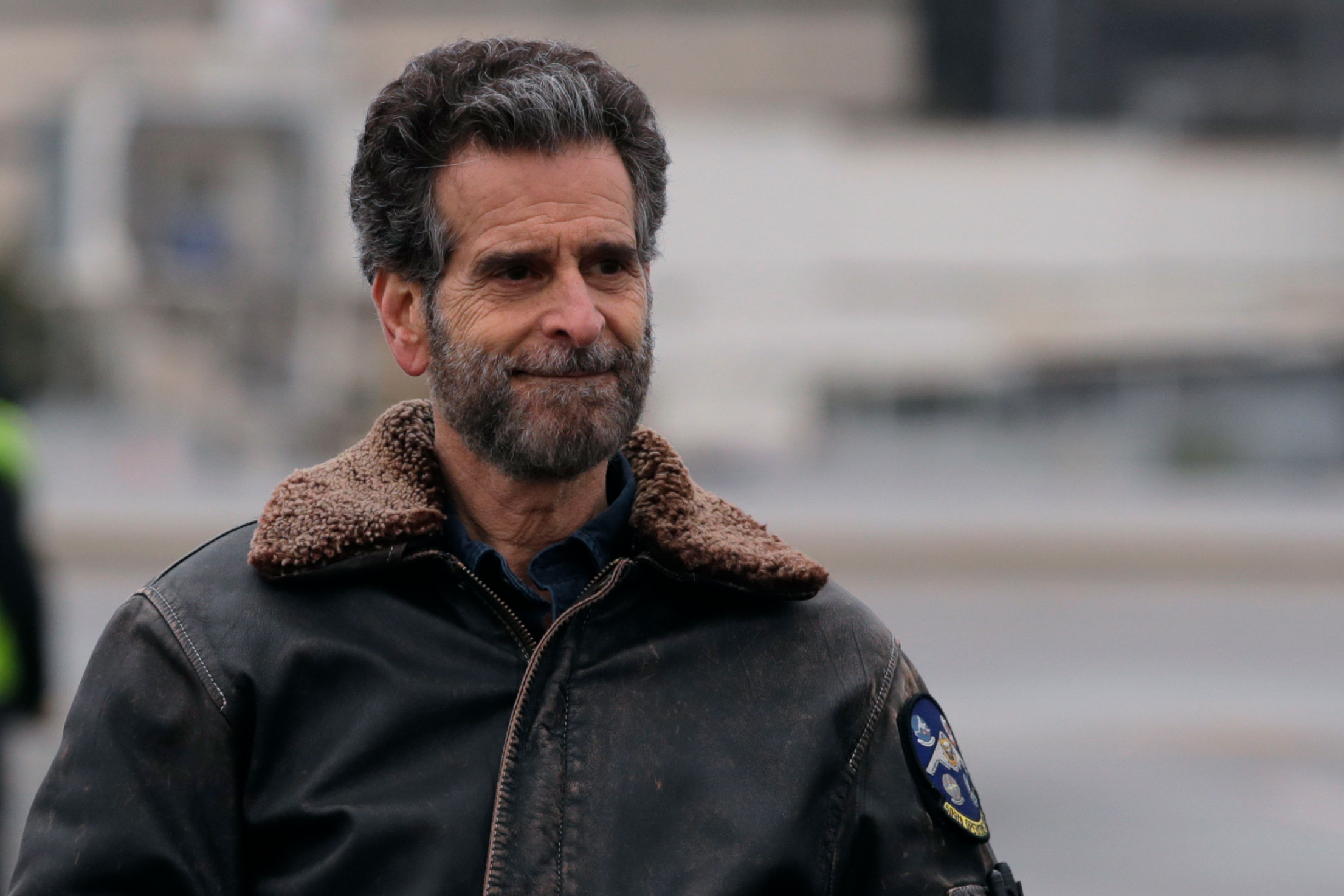 Inventor Dean Kamen looks on as over 110,000 pounds of personal protective equipment (PPE), shipped from Shanghai, China, is unloaded from a cargo plane at Manchester-Boston Regional Airport in Manchester, New Hampshire, Thursday, April 30, 2020