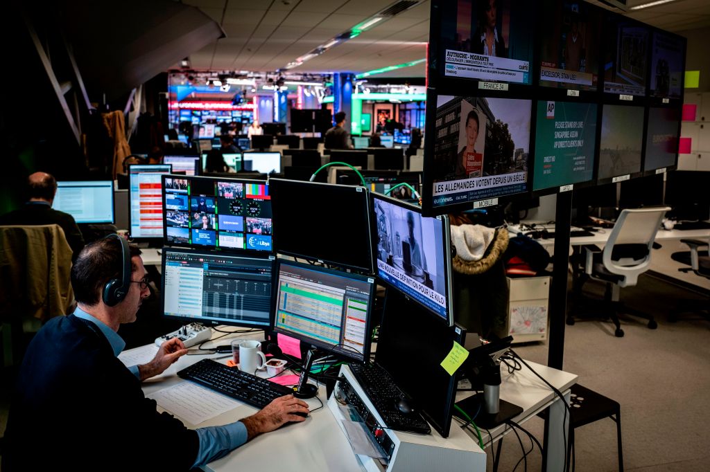 A newsroom in Europe with computer screens