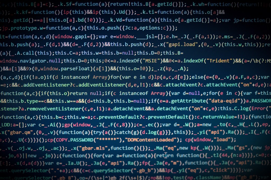 Computer code on a darkened blue background