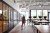 Woman walking through a co-working office, used in a post about Glints hiring report