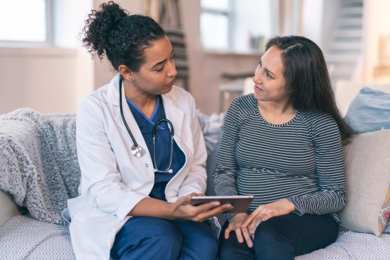 Doctor meeting with pregnant woman