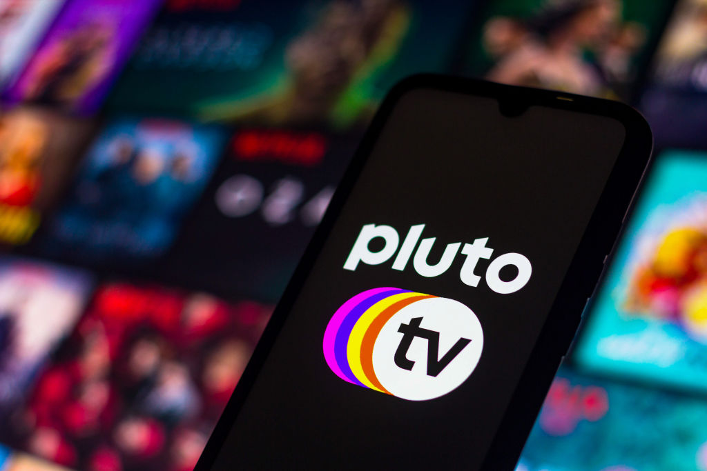 Pluto TV logo displayed on a smartphone