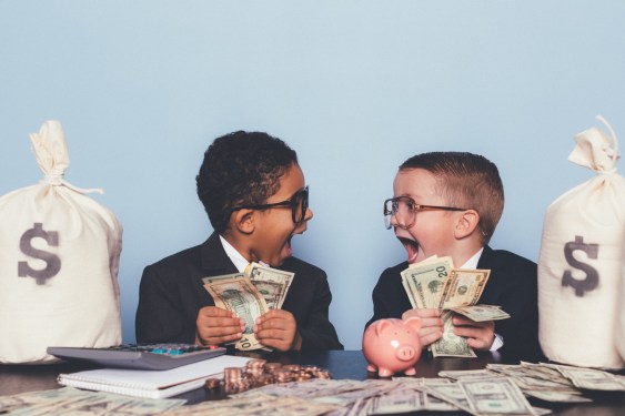 two young boys in suits holding wads of cash; neobanks fintech profitability